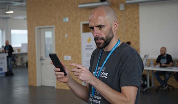 Alvaro Torres testing a form on his phone to validate that submissions are recorded